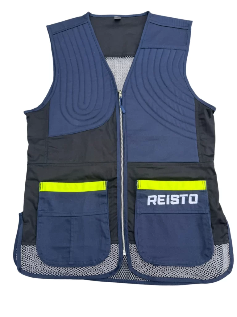 Front view of the Reisto clay pigeon shooting vest in navy and black with fluorescent yellow accents, featuring dual recoil pads and large cartridge pockets.