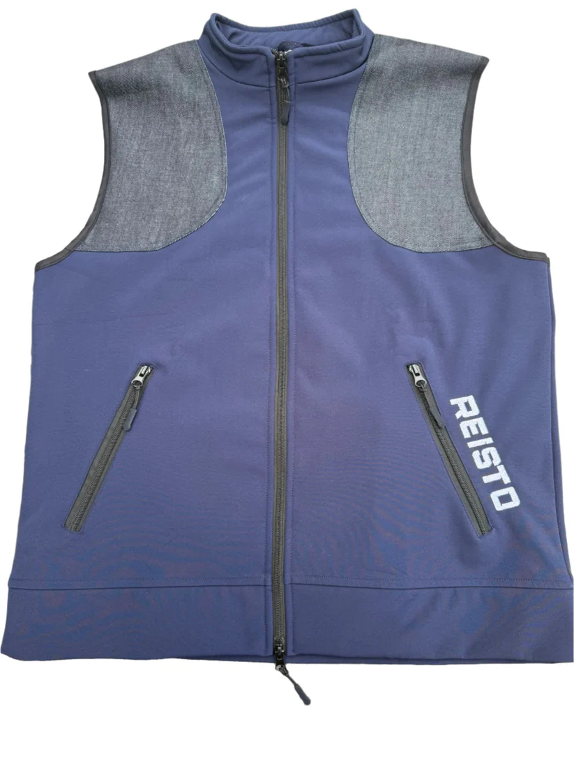 Front view of the Reisto softshell shooting vest in navy blue with grey padded shoulder panels and twin zip pockets, designed for modern clay pigeon shooting.
